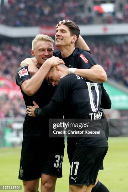 Andreas Beck of Stuttgart celebrates the third goal with Mario Gomez of Stuttgart and Erik Thommy of Stuttgart during the Bundesliga match between 1....