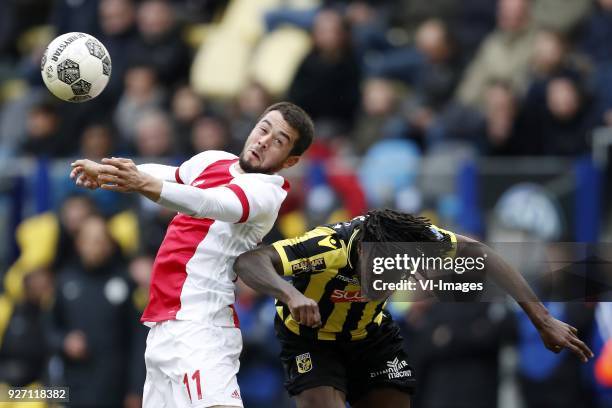 Amin Younes of Ajax, Fankaty Dabo of Vitesse during the Dutch Eredivisie match between Vitesse Arnhem and Ajax Amsterdam at Gelredome on March 04,...