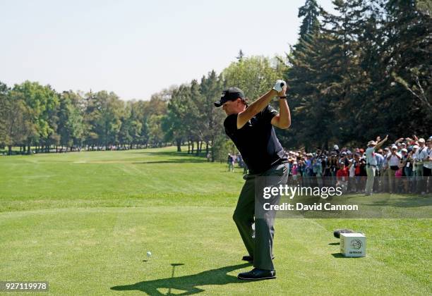 Phil Mickelson of the United States plays a driver from the second tee during the third round of the World Golf Championships-Mexico Championship at...