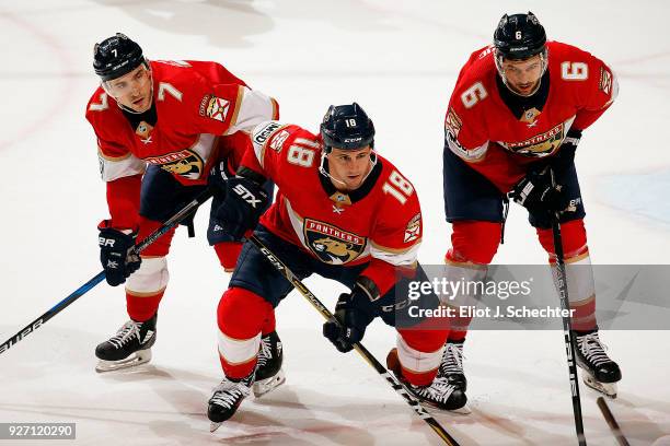 Micheal Haley of the Florida Panthers and teammates Colton Sceviour and Alex Petrovic get set for a face off against the Buffalo Sabres at the BB&T...