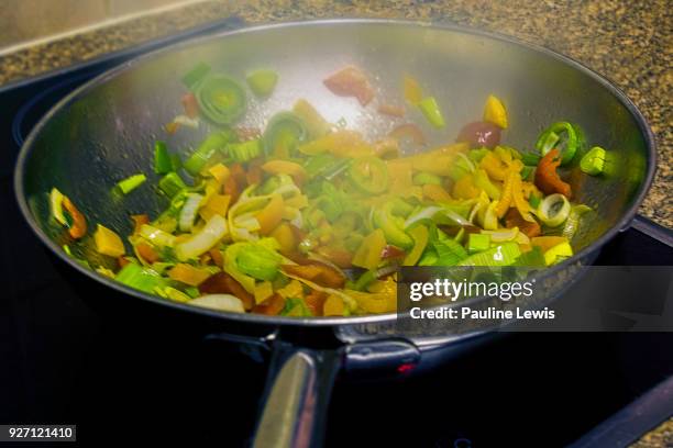 vegetable stir fry - stir frying european stock pictures, royalty-free photos & images