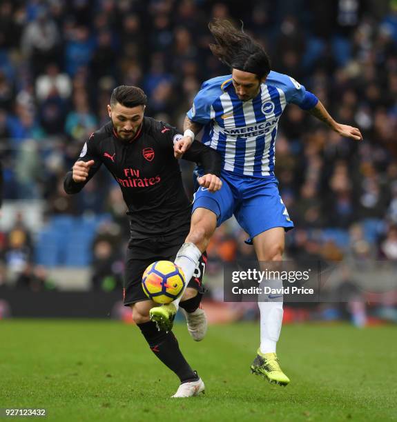 Sead Kolasinac of Arsenal challenges Ezequiel Schelotto of Brighton during the Premier League match between Brighton and Hove Albion and Arsenal at...