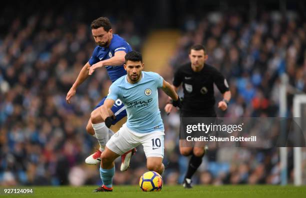 Danny Drinkwater of Chelsea puts pressure on Sergio Aguero of Manchester City during the Premier League match between Manchester City and Chelsea at...