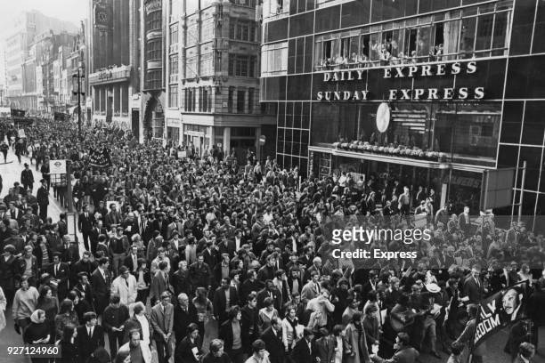 Marchers pass the Daily Express Building in Fleet Street on their way to St Paul's Cathedral to pay tribute to assassinated American civil rights...