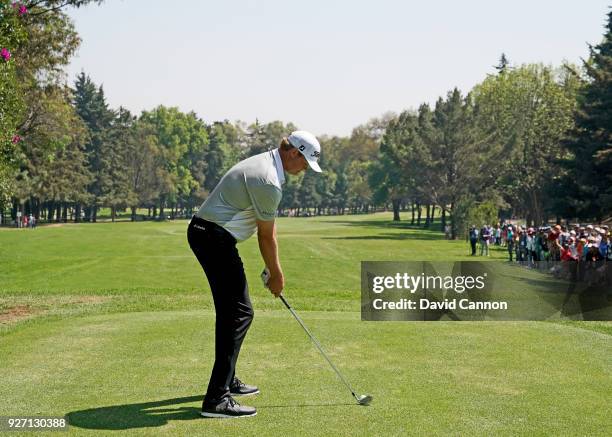 Patton Kizzire of the United States plays a long iron from the second tee during the third round of the World Golf Championships-Mexico Championship...