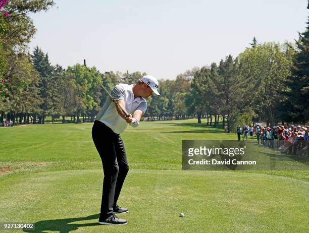 Patton Kizzire of the United States plays a long iron from the second tee during the third round of the World Golf Championships-Mexico Championship...