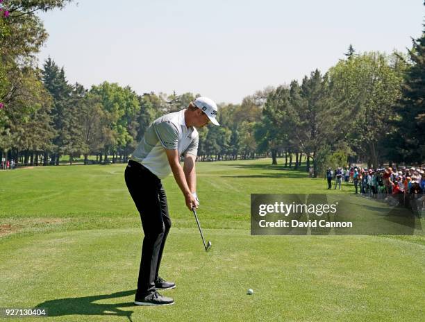 Patton Kizzire of the United States plays a long iron from the second tee during the third round of the World Golf Championships-Mexico Championship...