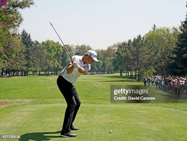 Patton Kizzire of the United States plays a long iron from the second tee during the third round of the World Golf Championships-Mexico Championship...