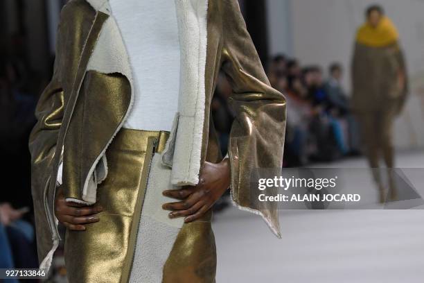 Model presents a creation for Akris during the 2018/2019 fall/winter collection fashion show on March 4, 2018 in Paris.