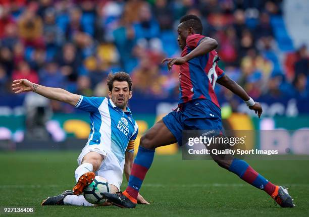 Emmanuel Okyere Boateng of Levante competes for the ball with Victor Sanchez of Espanyol during the La Liga match between Levante and Espanyol at...