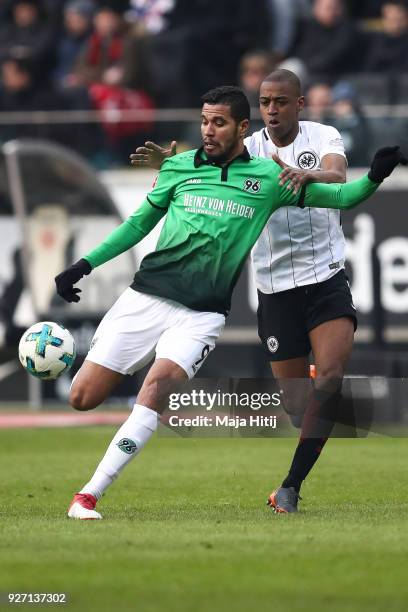 Jonathas of Hannover 96 and Gelson Fernandes of Eintracht Frankfurt battle for the ball during the Bundesliga match between Eintracht Frankfurt and...