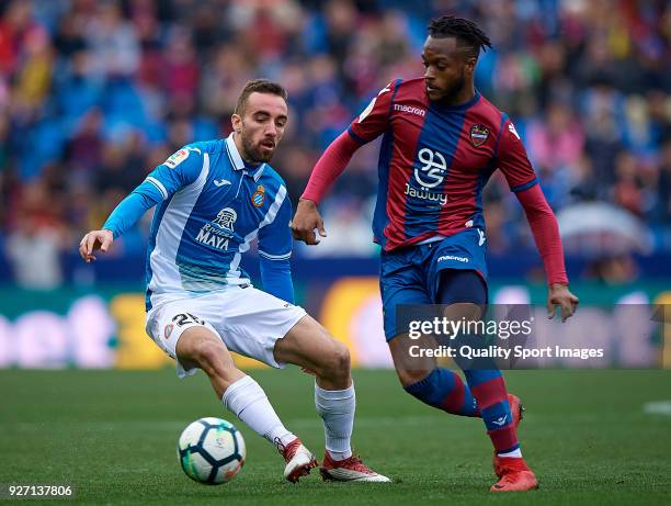 Cheik Doukoure of Levante competes for the ball with Sergi Darder of Espanyol during the La Liga match between Levante and Espanyol at Ciutat de...