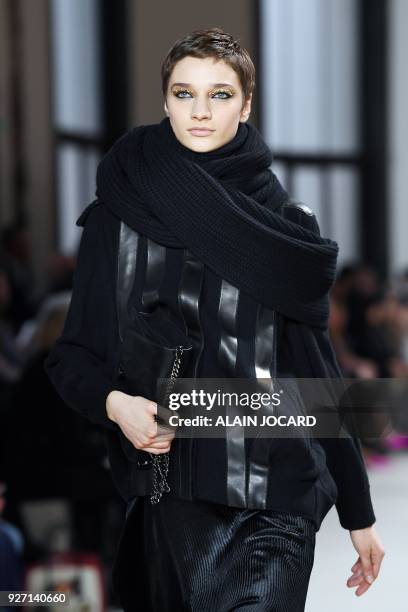 Model presents a creation for Akris during the 2018/2019 fall/winter collection fashion show on March 4, 2018 in Paris.