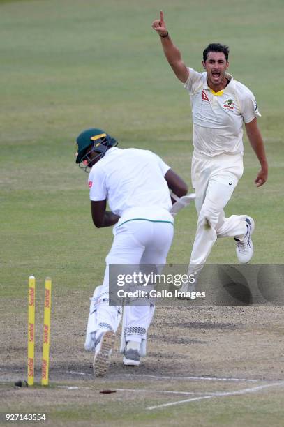 Mitchell Starc of Australia celebrates the wicket of Kagiso Rabada of the Proteas during day 4 of the 1st Sunfoil Test match between South Africa and...