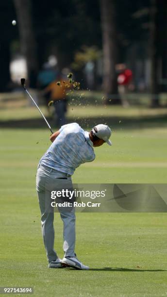 Rickie Fowler plays his second shot into th eight green during the third round of World Golf Championships-Mexico Championship at Club de Golf...