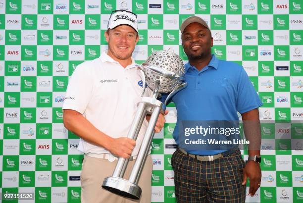 George Coetzee of South Africa is awarded the trophy after winning the Tshwane Open at Pretoria Country Club on March 4, 2018 in Pretoria, South...