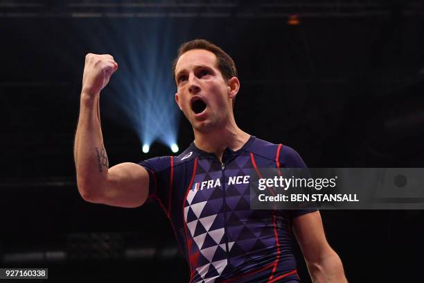 France's Renaud Lavillenie reacts after clearing 5.90m in the men's pole vault final at the 2018 IAAF World Indoor Athletics Championships at the...