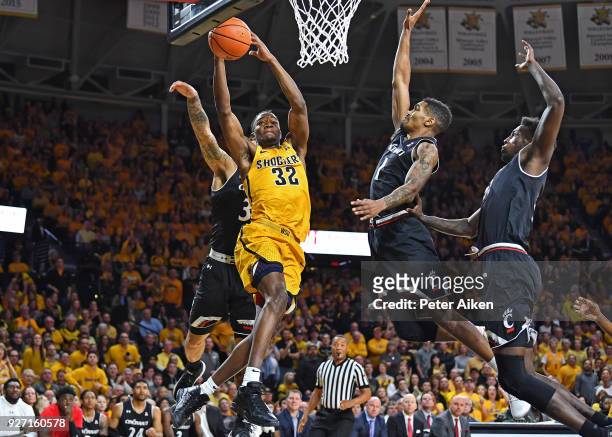 Markis McDuffie of the Wichita State Shockers drives to the basket against Jacob Evans of the Cincinnati Bearcats during the first half on March 4,...
