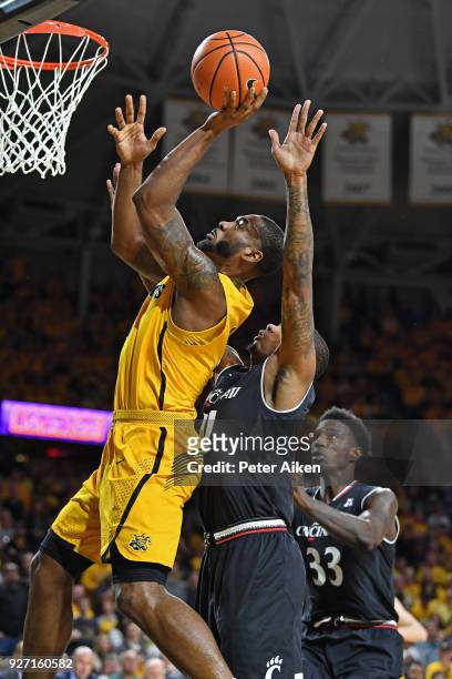 Rashard Kelly of the Wichita State Shockers scores a basket against Jacob Evans of the Cincinnati Bearcats during the first half on March 4, 2018 at...