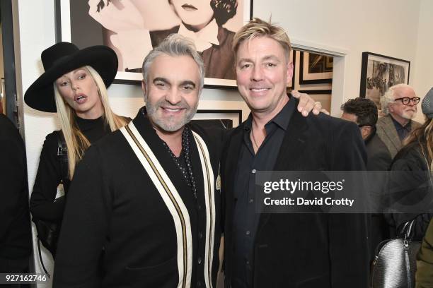 Foreground Designer Martyn Lawrence Bullard and partner, property developer Michael Green at Rolston's Hollywood Royale exhibition preview at...
