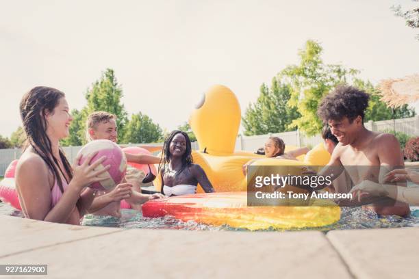 Group of teenagers playing in pool
