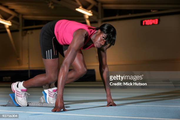 English runner Christine Ohuruogu poses on starting blocks for a portrait session at Lea Valley Athletics Centre on December 16th, 2008 in London.