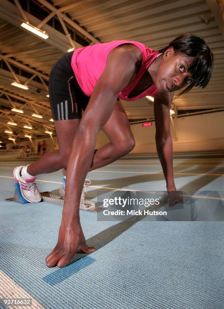 English runner Christine Ohuruogu poses on starting blocks for a portrait session at Lea Valley Athletics Centre on December 16th, 2008 in London.