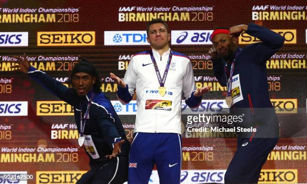 Gold Medallist, Andrew Pozzi of Great Britain, Bronze Medallist, Aurel Manga of France and Silver Medallist, Jarret Eaton of United States celebrate...