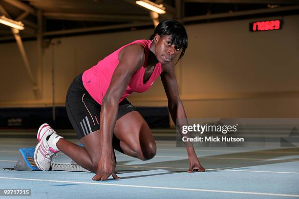 English runner Christine Ohuruogu poses on starting blocks for a portrait session at Lea Valley Athletics Centre on December 16th, 2008 in London.