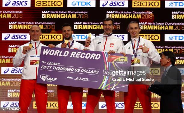 World Indoor Record holders Karol Zalewski, Rafal Omelko, Lukasz Krawczuk and Jakub Krzewina of Poland after winning the Men's 4 x 400 Metres Relay...