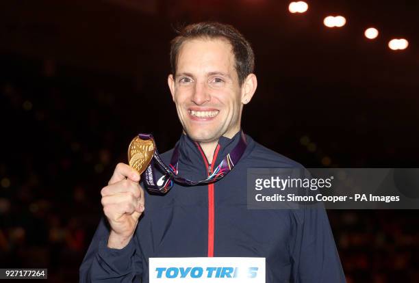 France's Renaud Lavillenie poses with his gold medal after winning the Men's Pole Vault during day four of the 2018 IAAF Indoor World Championships...