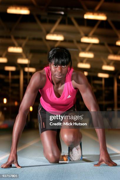 English runner Christine Ohuruogu poses on starting blocks for a portrait session at Lea Valley Athletics Centre on December 16th, 2008 in London.