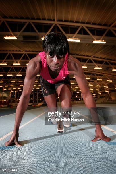 English runner Christine Ohuruogu poses on starting blocks for a portrait session at Lea Valley Athletics Centre on December 16th, 2008 in London.