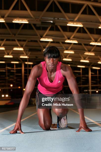 English runner Christine Ohuruogu poses on starting blocks for a portrait session at Lea Valley Athletics Centre on December 16th, 2008 in London.