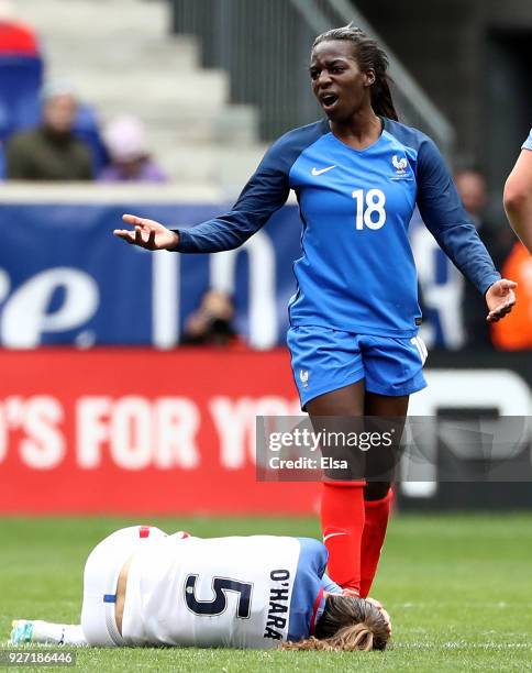 Viviane Asseyi of France is given a yellow card after she collided with Kelley O'Hara of United States of America in the first half during the...
