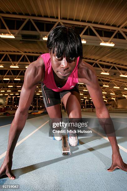 English runner Christine Ohuruogu poses on starting blocks for a portrait session at Lea Valley Athletics Centre on December 16th, 2008 in London.