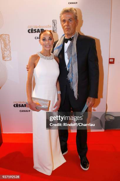 Chief Executive of the Lucien Barriere Group, Dominique Desseigne and Alexandra Cardinale attend the Cesar Film Awards 2018 at Salle Pleyel on March...