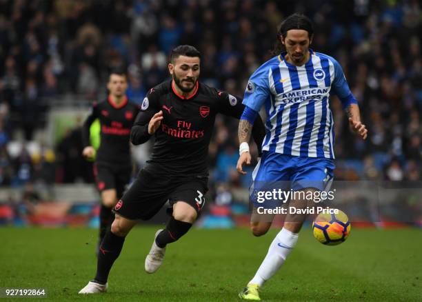 Sead Kolasinac of Arsenal challenges Ezequiel Schelotto of Brighton during the Premier League match between Brighton and Hove Albion and Arsenal at...