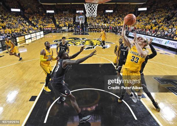 Conner Frankamp of the Wichita State Shockers drives in for a basket against the Cincinnati Bearcats during the second half on March 4, 2018 at...