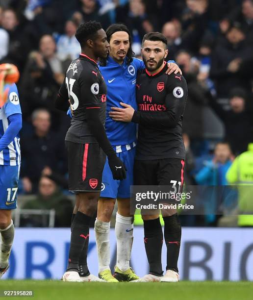 Sead Kolasinac of Arsenal embrace Ezequiel Schelotto of Brighton after the Premier League match between Brighton and Hove Albion and Arsenal at Amex...