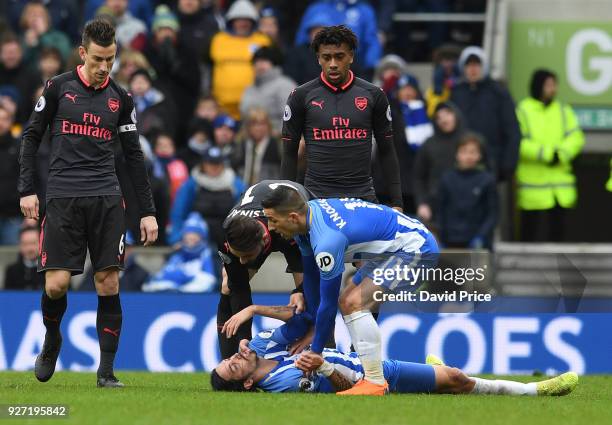 Sead Kolasinac of Arsenal and check Anthony Knockhaert of Brighton on Ezequiel Schelotto of Brighton during the Premier League match between Brighton...