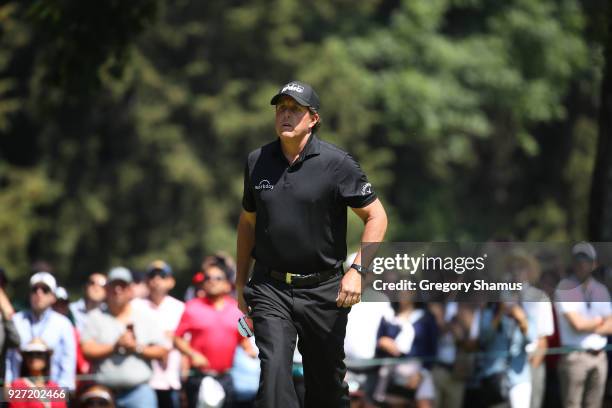 Phil Mickelson looks on after putting on the second green on the second hole during the final round of World Golf Championships-Mexico Championship...