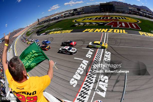 Ryan Blaney, driver of the Menards/Pennzoil Ford, takes the green flag to start the Monster Energy NASCAR Cup Series Pennzoil 400 presented by Jiffy...