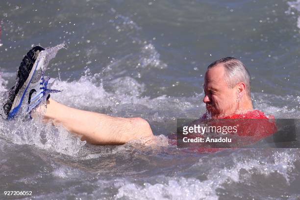 Man takes part in the 18th Annual Chicago Polar Plunge organized to support the athletes of Special Olympics at North Ave Beach of Michigan Lake in...