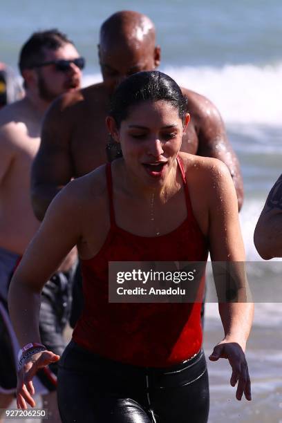 Woman takes part in the 18th Annual Chicago Polar Plunge organized to support the athletes of Special Olympics at North Ave Beach of Michigan Lake in...