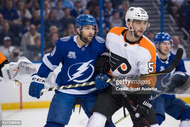 Cory Conacher of the Tampa Bay Lightning against Shayne Gostisbehere of the Philadelphia Flyers at Amalie Arena on March 3, 2018 in Tampa, Florida. "n