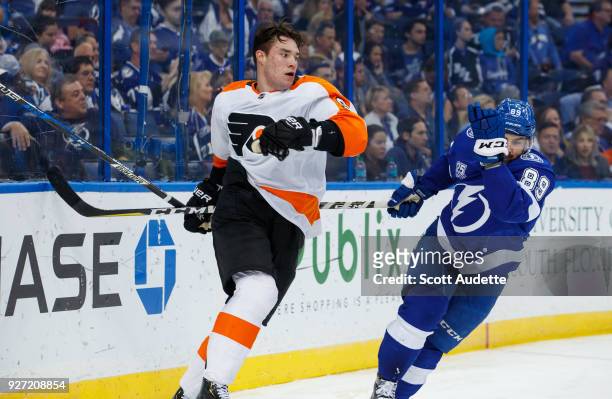 Cory Conacher of the Tampa Bay Lightning against Ivan Provorov of the Philadelphia Flyers at Amalie Arena on March 3, 2018 in Tampa, Florida. "n
