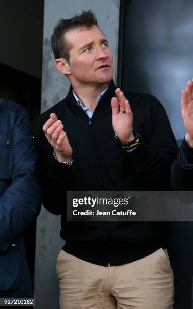 Former rider Thomas Voeckler of France in his new role of ambassador for ASO, organizer of Paris-Nice and Tour de France among others during stage 1...