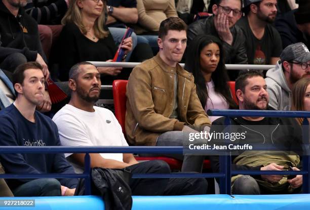 Former French NBA player Boris Diaw, Thomas Meunier of PSG and his pregnant girlfriend Deborah Panzokou attend the EHF Champions League match between...