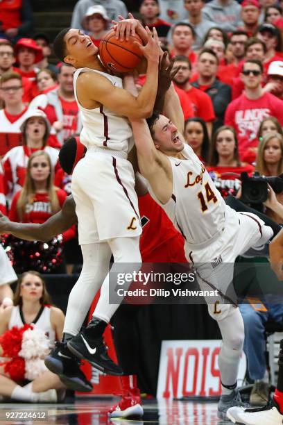 Lucas Williamson and Ben Richardson of the Loyola Ramblers pull down a rebound against the Illinois State Redbirds during the Missouri Valley...